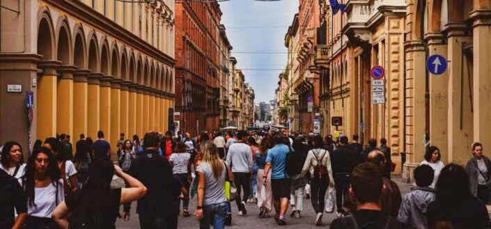 People Walking Down the Streets of Bologna